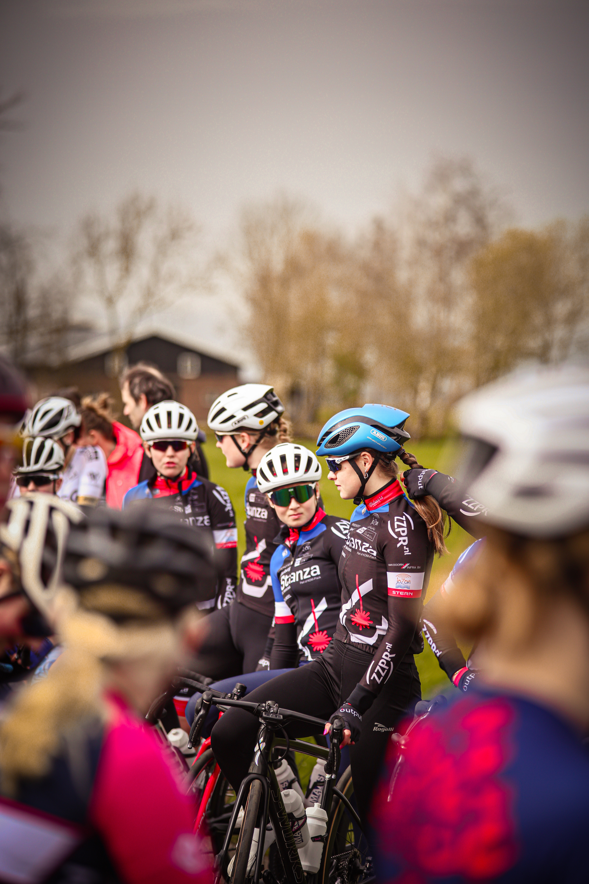 A group of cyclists at the start line for the Ronde Van de Lichtmis race.