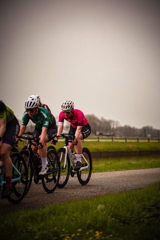 Two cyclists are racing down a road during the Ronde van de Lichtmis in 2024.