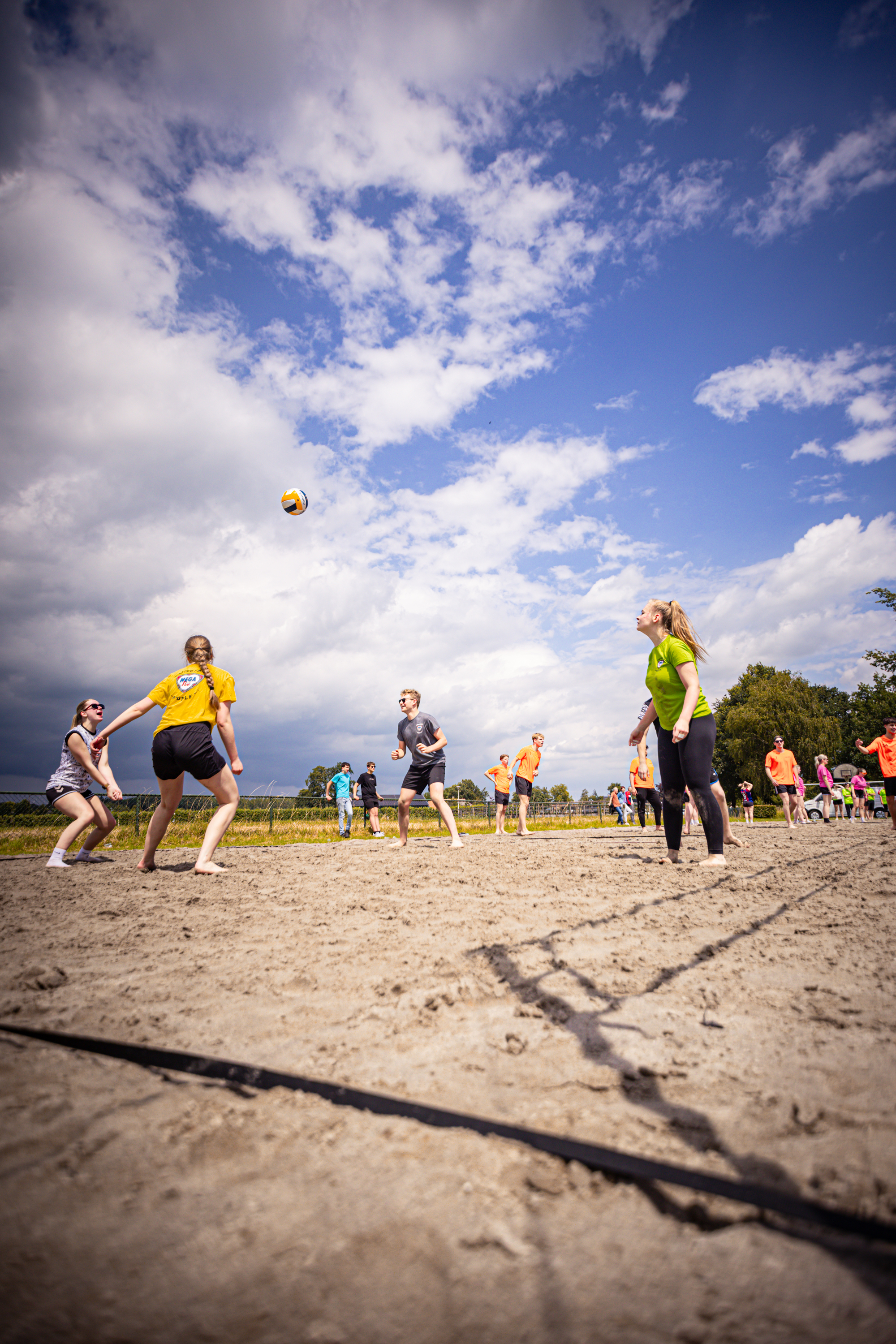 Boerhaar beach volleyball players playing game on a sunny day.