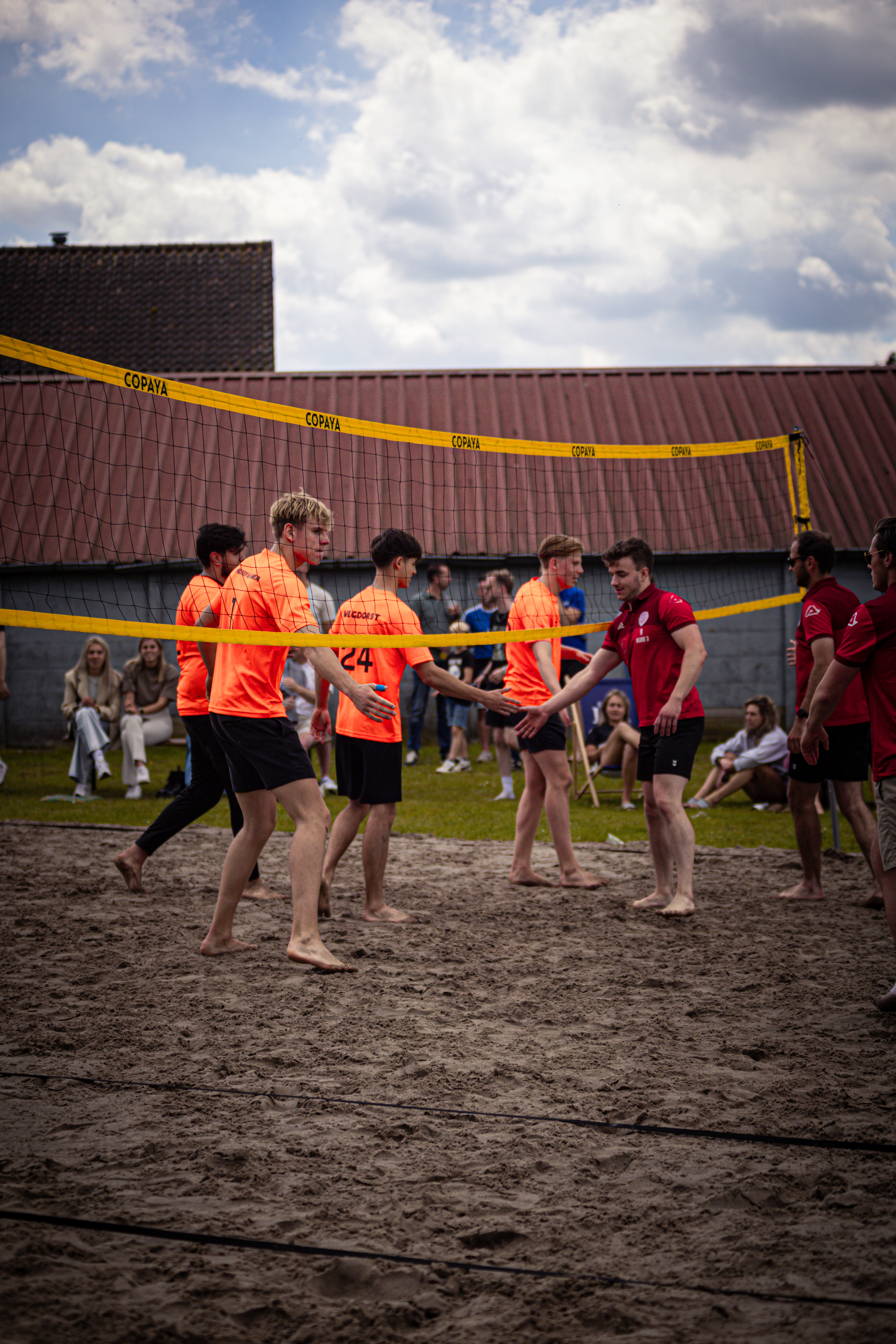 A group of people are playing beach volleyball in the Netherlands.