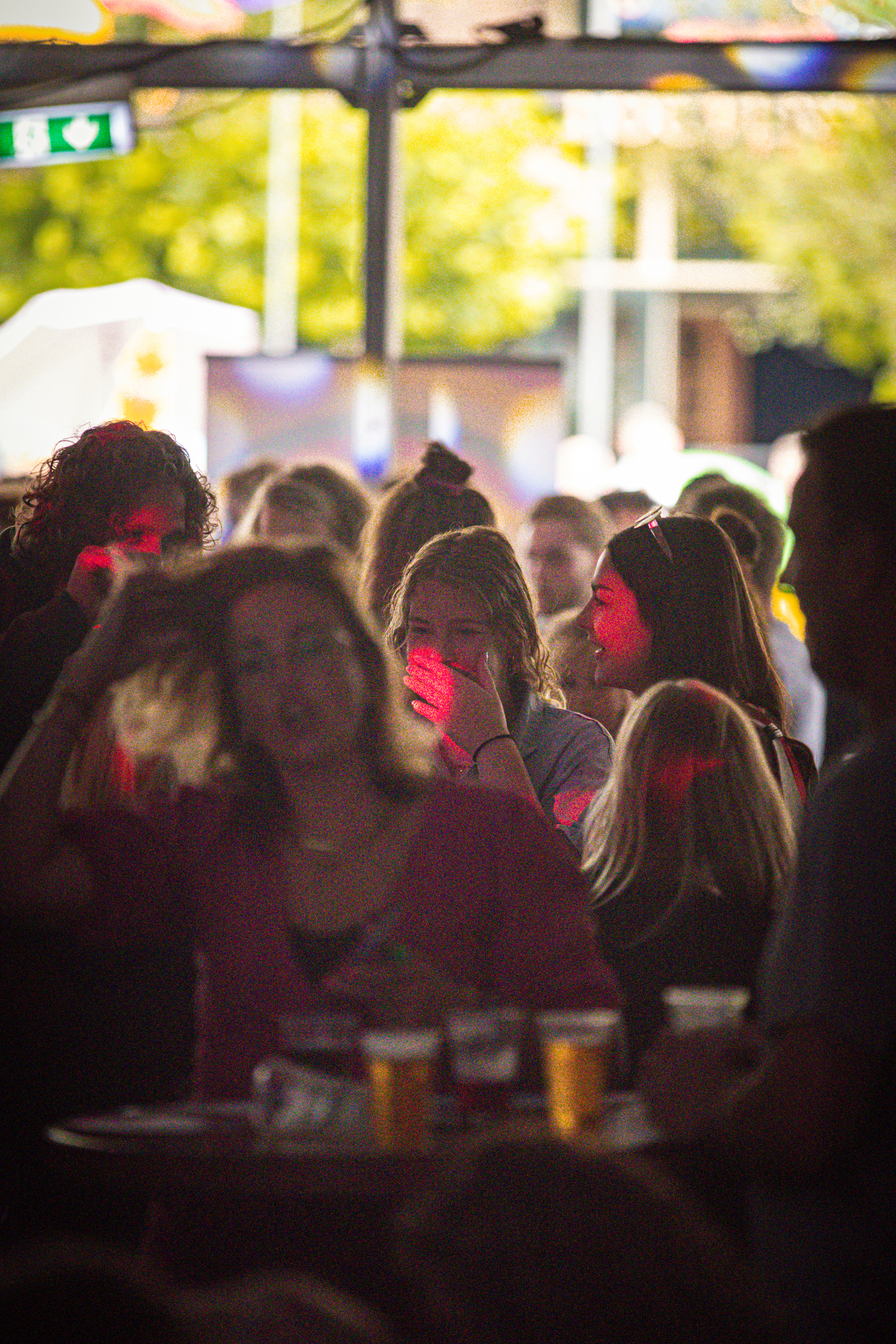 A group of people gathered around a table with drinks in front of them.