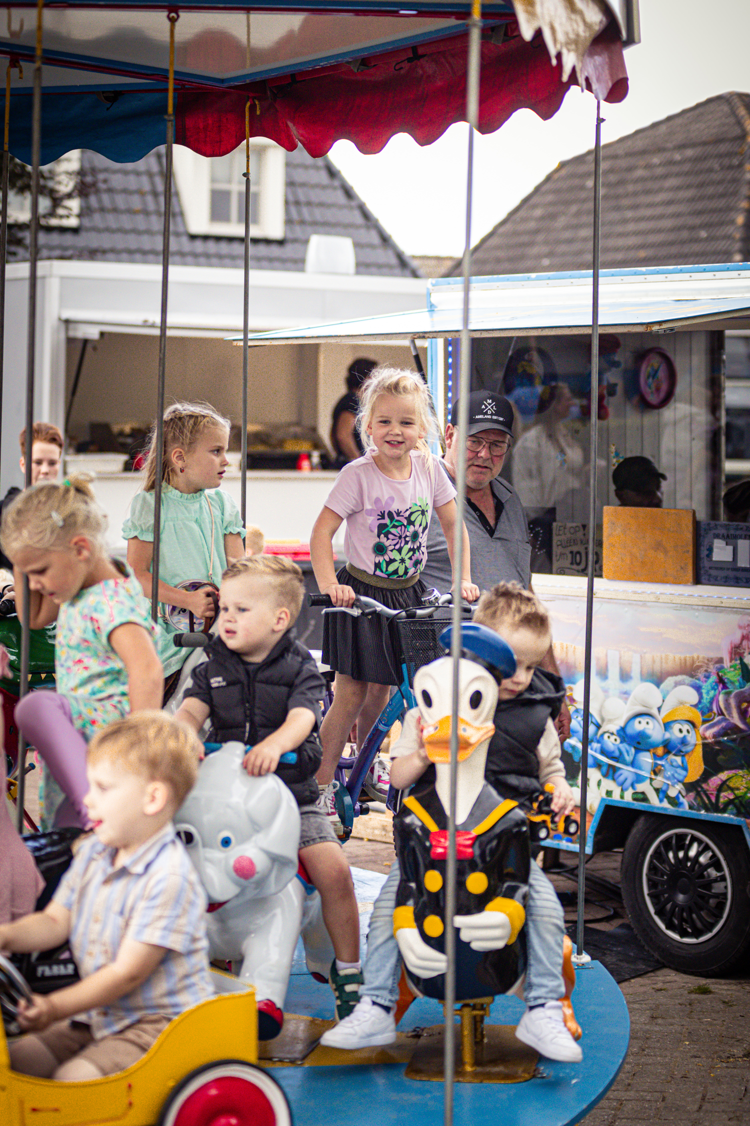 a group of children playing in a park with kermis boerhaar as the theme.