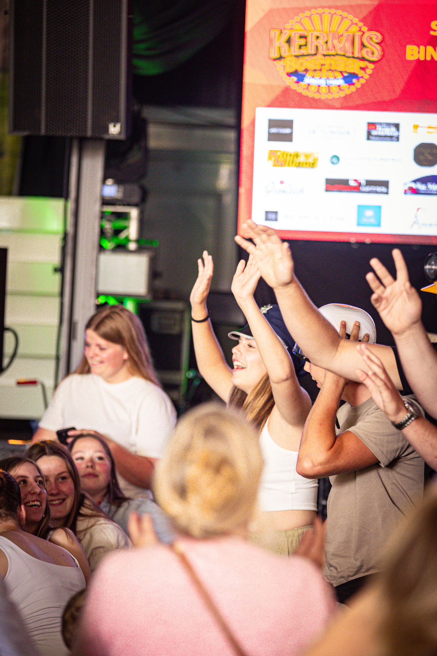 A large group of people celebrate at the Kermis Boerhaar event.