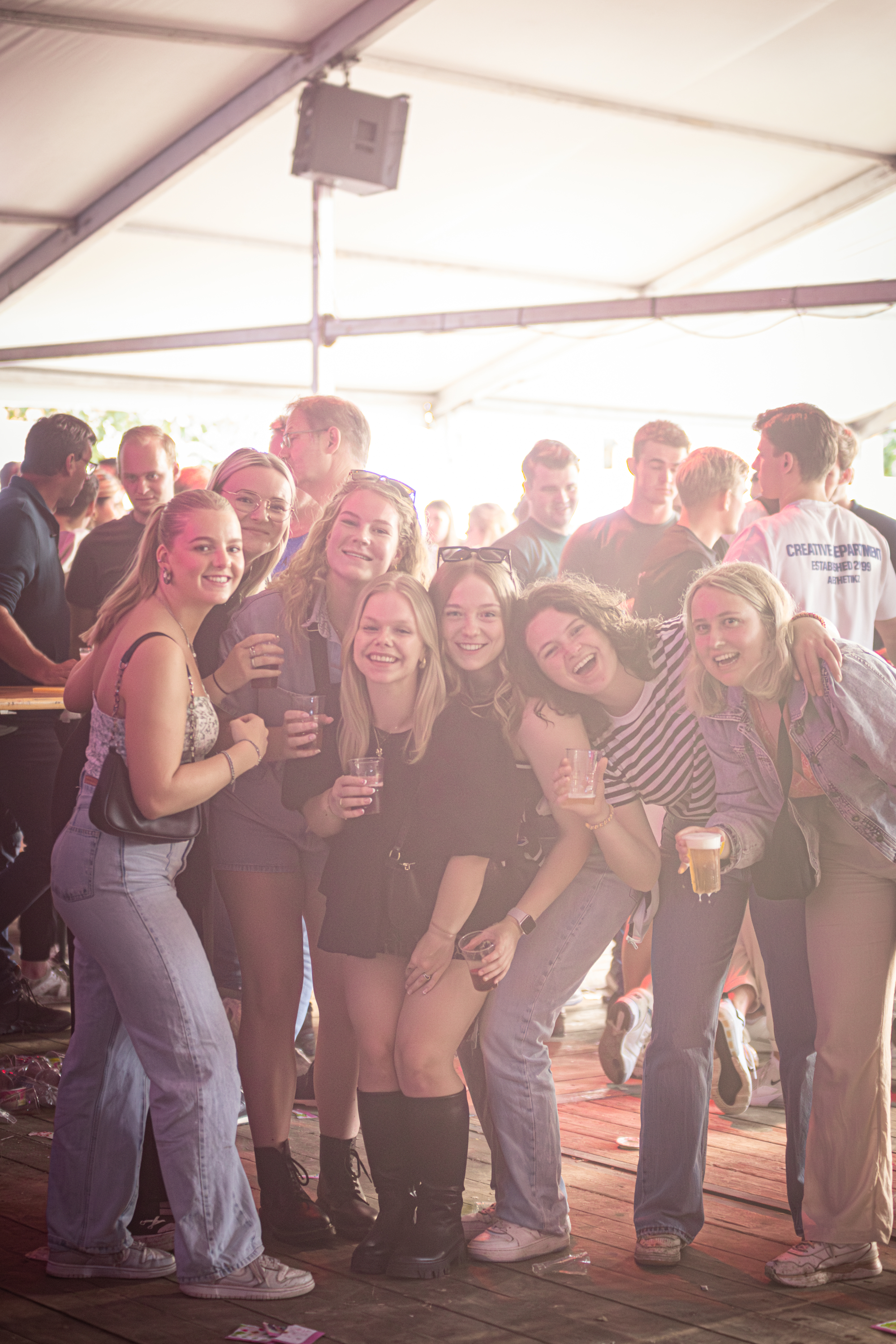 A group of people enjoying themselves at an outdoor festival.