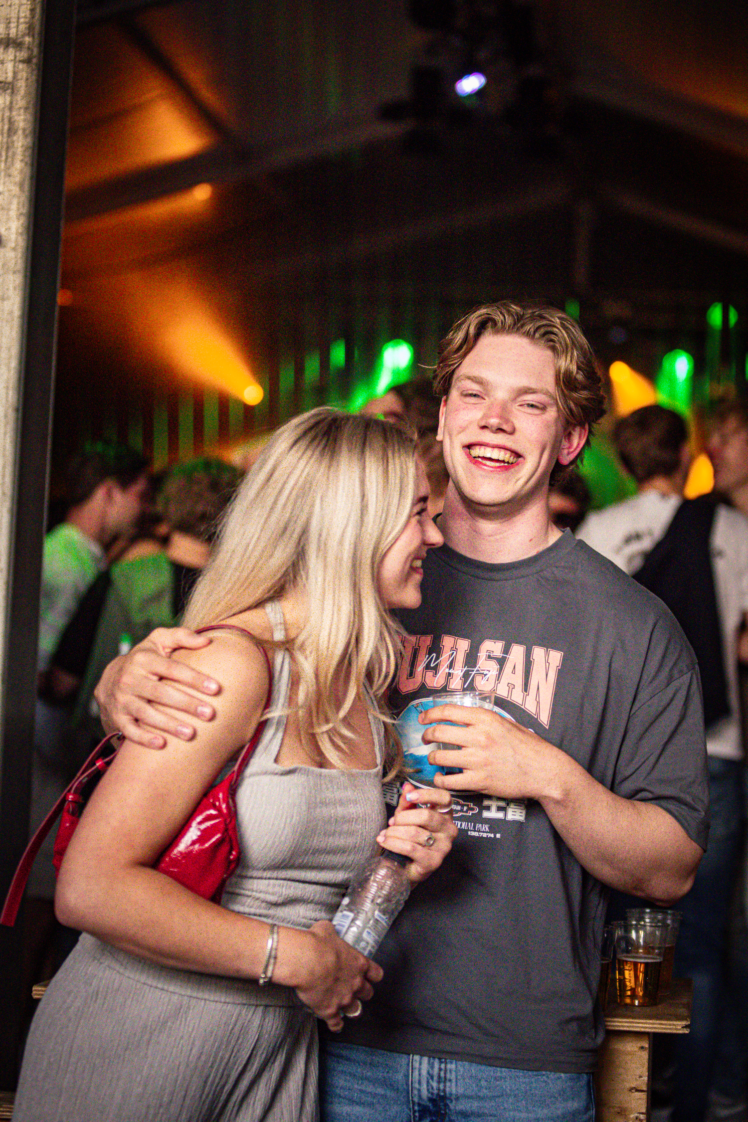 Two people are hugging each other at a party in the Netherlands.