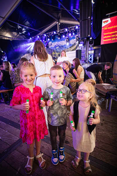 A group of children are at a Kermis Boerhaar, enjoying their time.