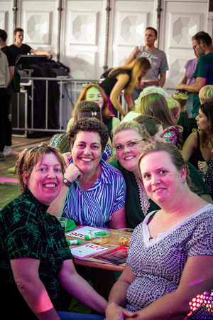 A group of friends sit around a table at Kermis Boerhaar.