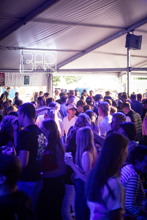 A group of people in line to get food at the Kermis Boerhaar event.