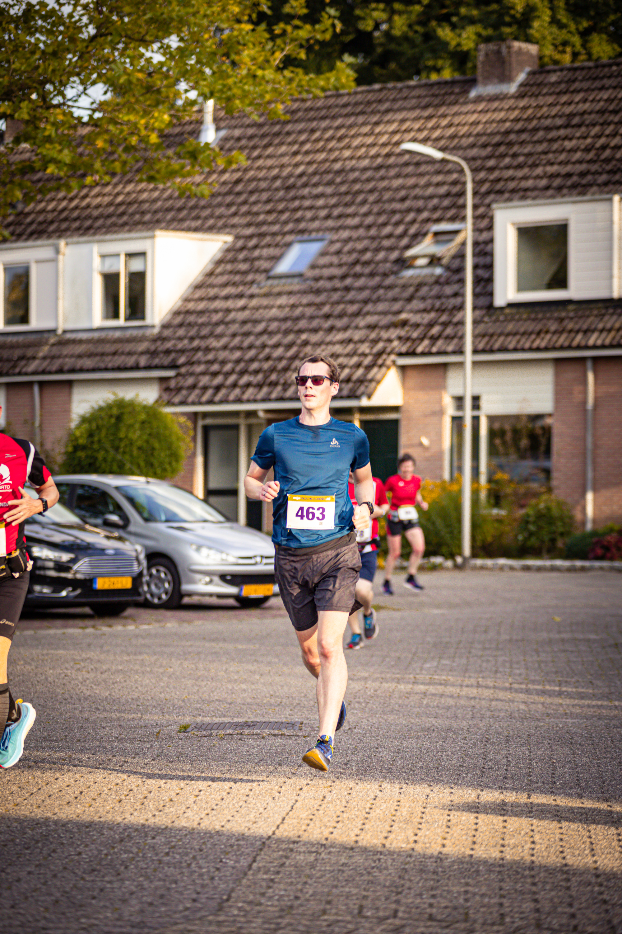 A runner is wearing a race bib that has the number 488 on it.