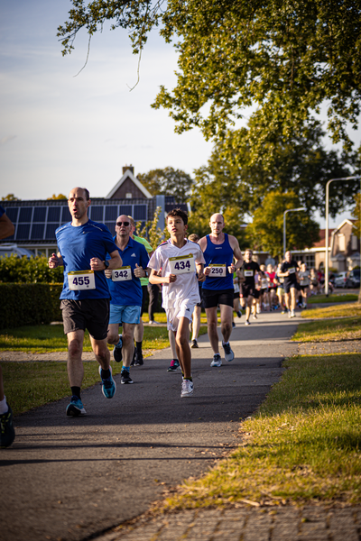 A group of people are running a marathon. The photo was taken on September 9th, 2018.