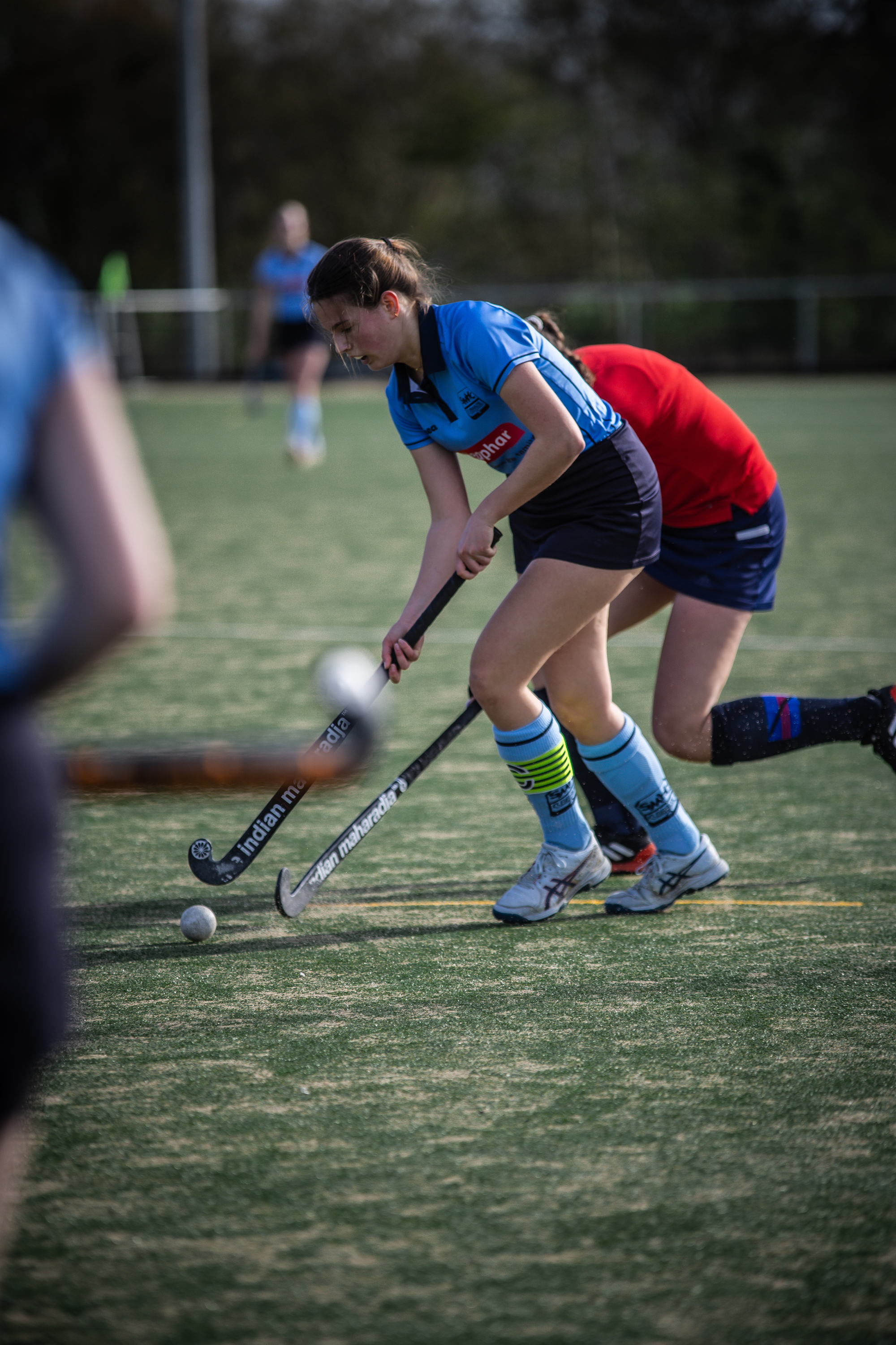 A hockey game with player number 6 holding a stick.