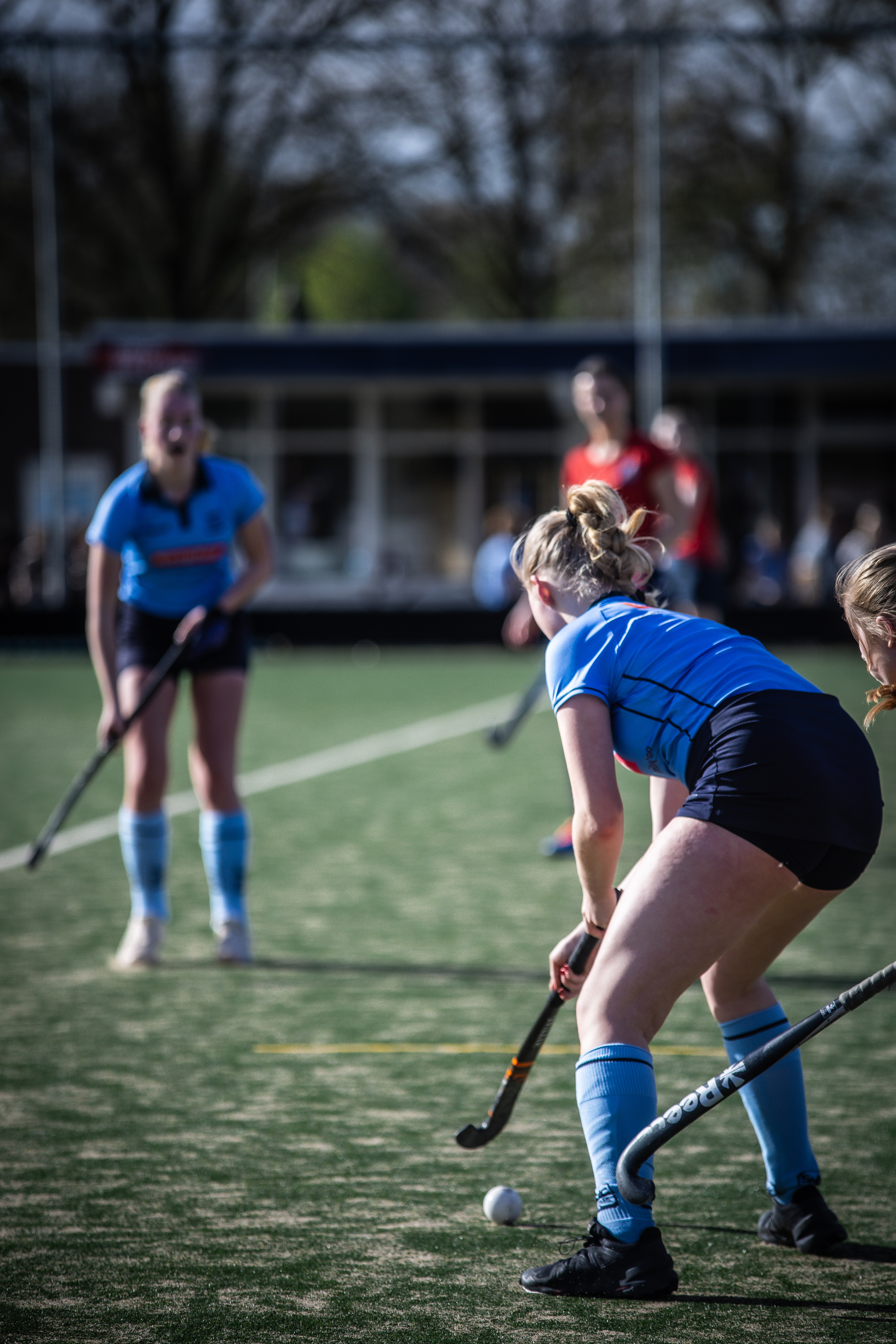 A girl in a blue uniform playing field hockey on April 7th at SMHC.