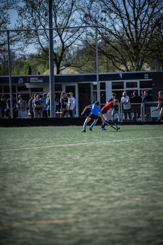 Hockey players playing on a field during the 2024 SMHC game.