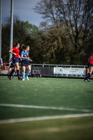 A group of women playing hockey. The date is the 7th of April.