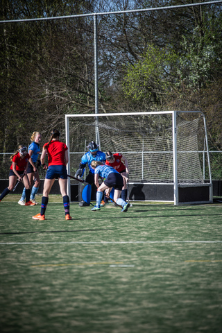 A group of female hockey players on a field in 2024.