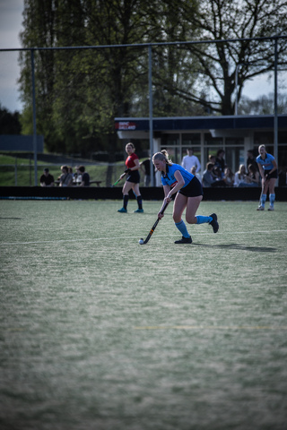 a girl wearing a blue jersey with the number 11 on it.