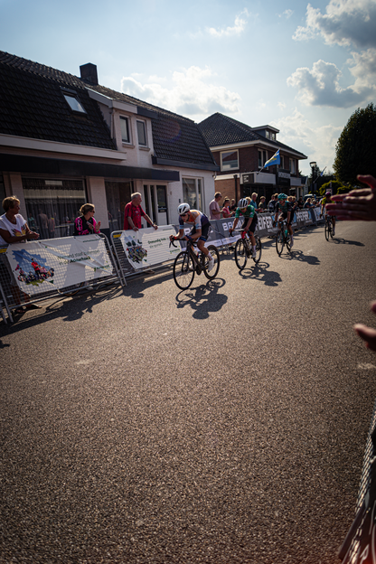 People on bicycles are participating in the Wielrennen event.