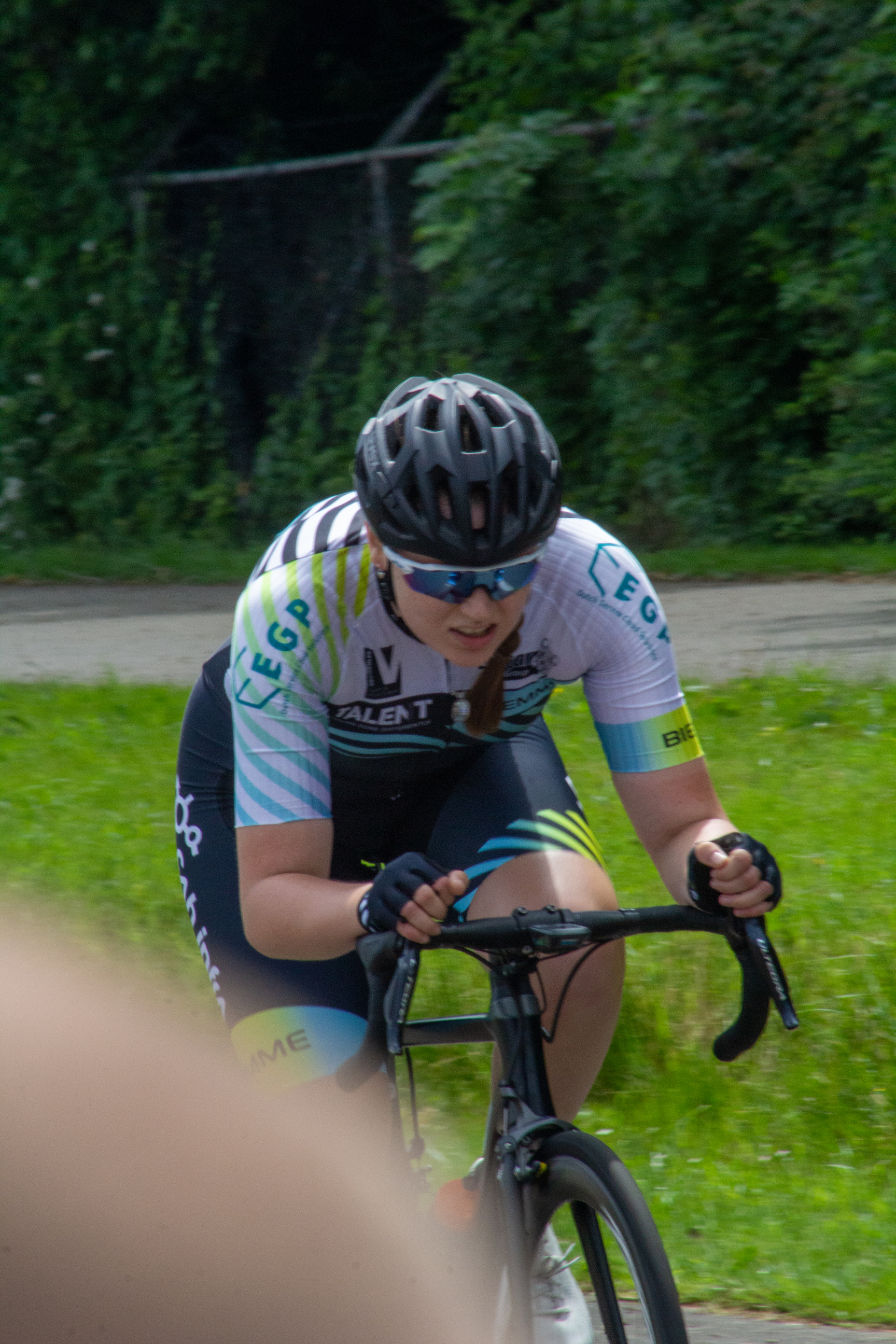 A girl on a bicycle, participating in the 2021 Dames ronde van Deventer.