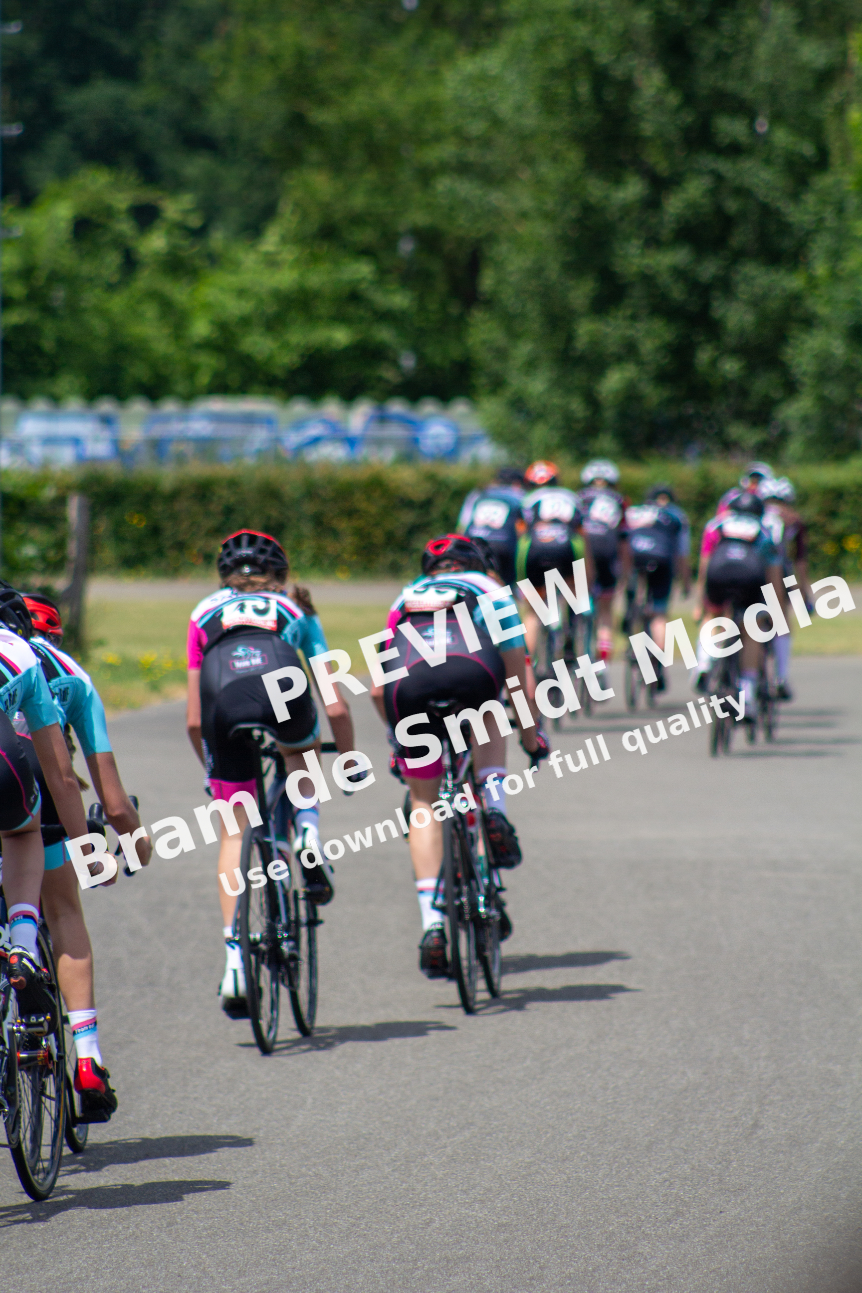 A group of women on bicycles taking part in the Dames ronde van Deventer cycling race.
