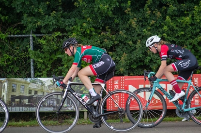 Two cyclists compete in the Dames ronde van Deventer race.