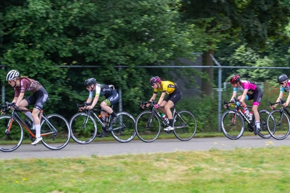 A group of women on bicycles participate in the 2021 Dames Ronde Van Deventer race.