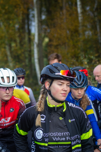 A group of cyclists are wearing helmets with visors.