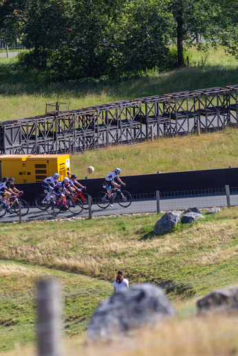 A group of cyclists race down a hill in the Netherlands.