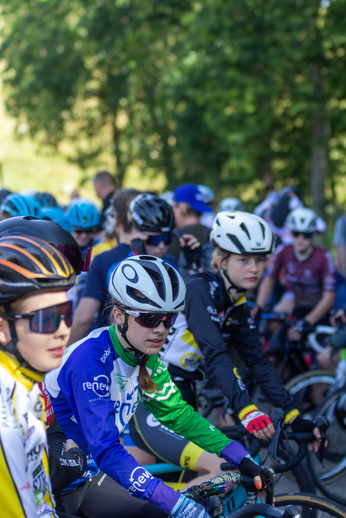 A cycling team is participating in a race on a sunny day.