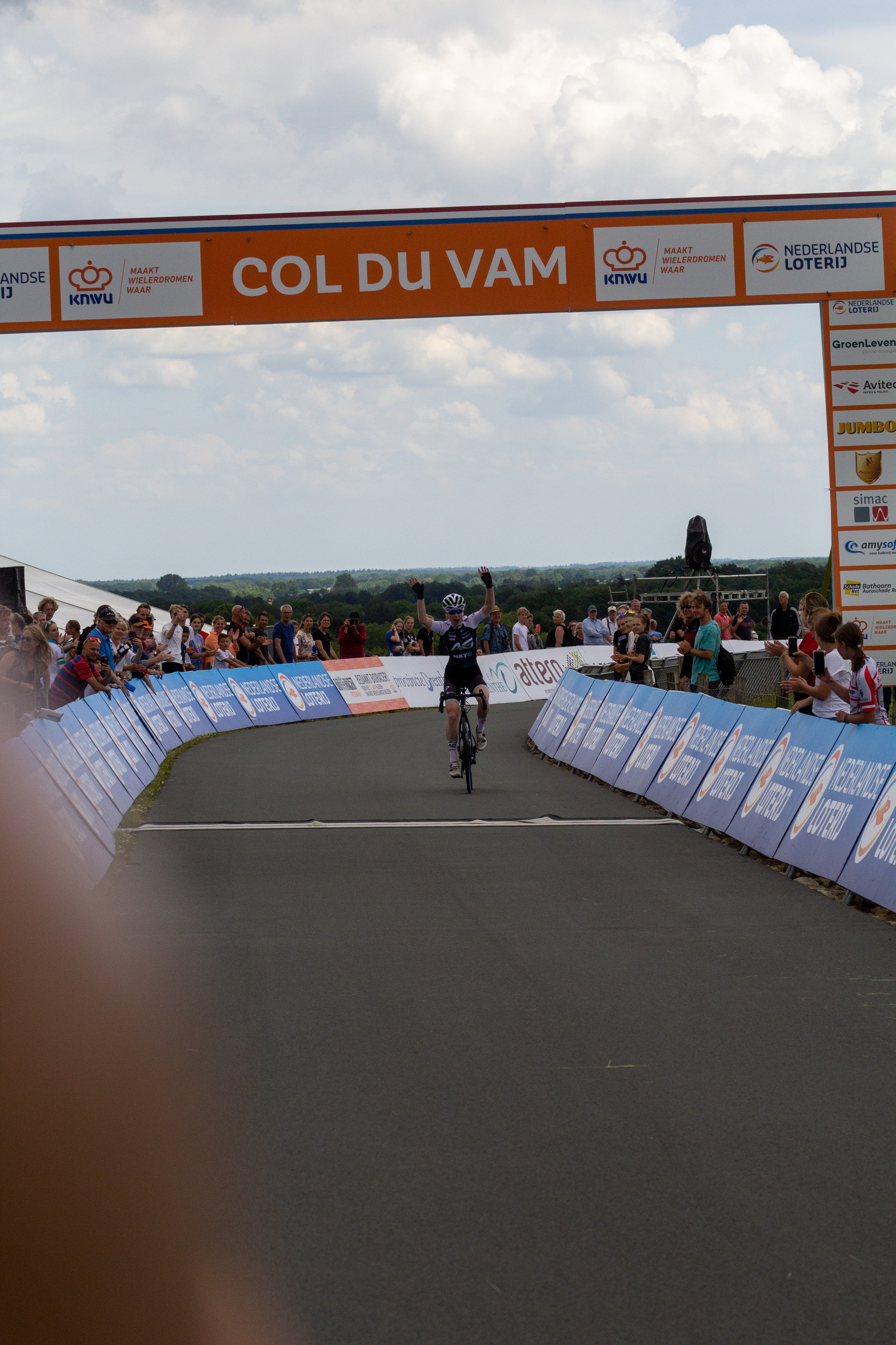 A person riding a bicycle under the name Col du Vam.