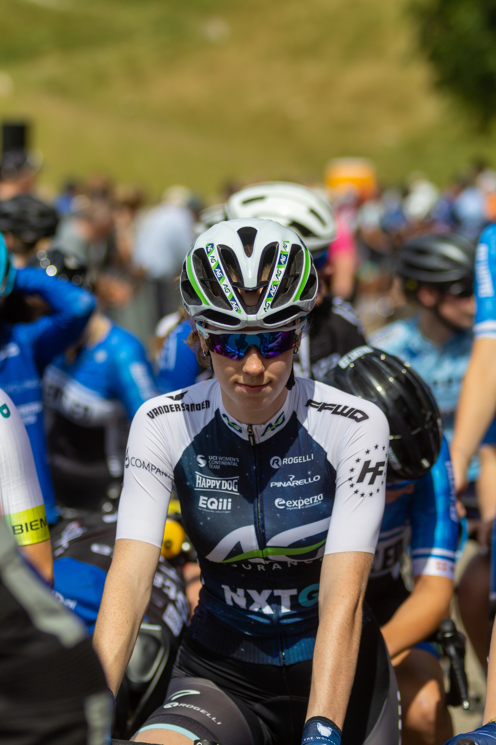 A group of cyclists wearing uniforms sponsored by Nike and Giant.