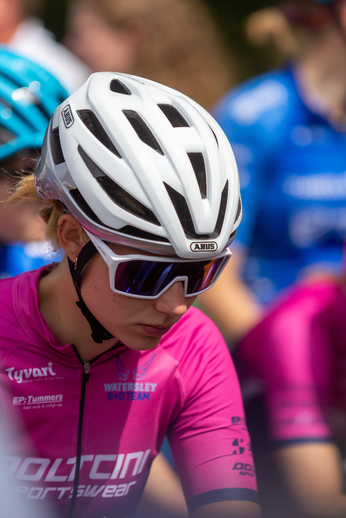 A woman wearing a pink jersey with the word "trenton" on it.