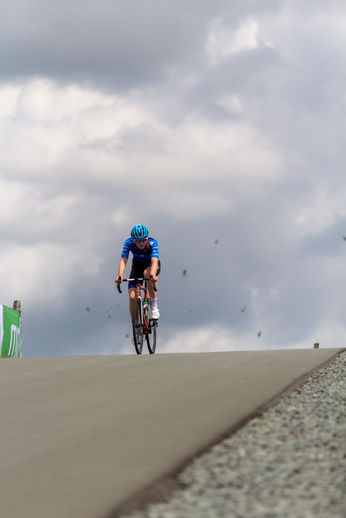 a person riding a bike with the label NK Dames on it.