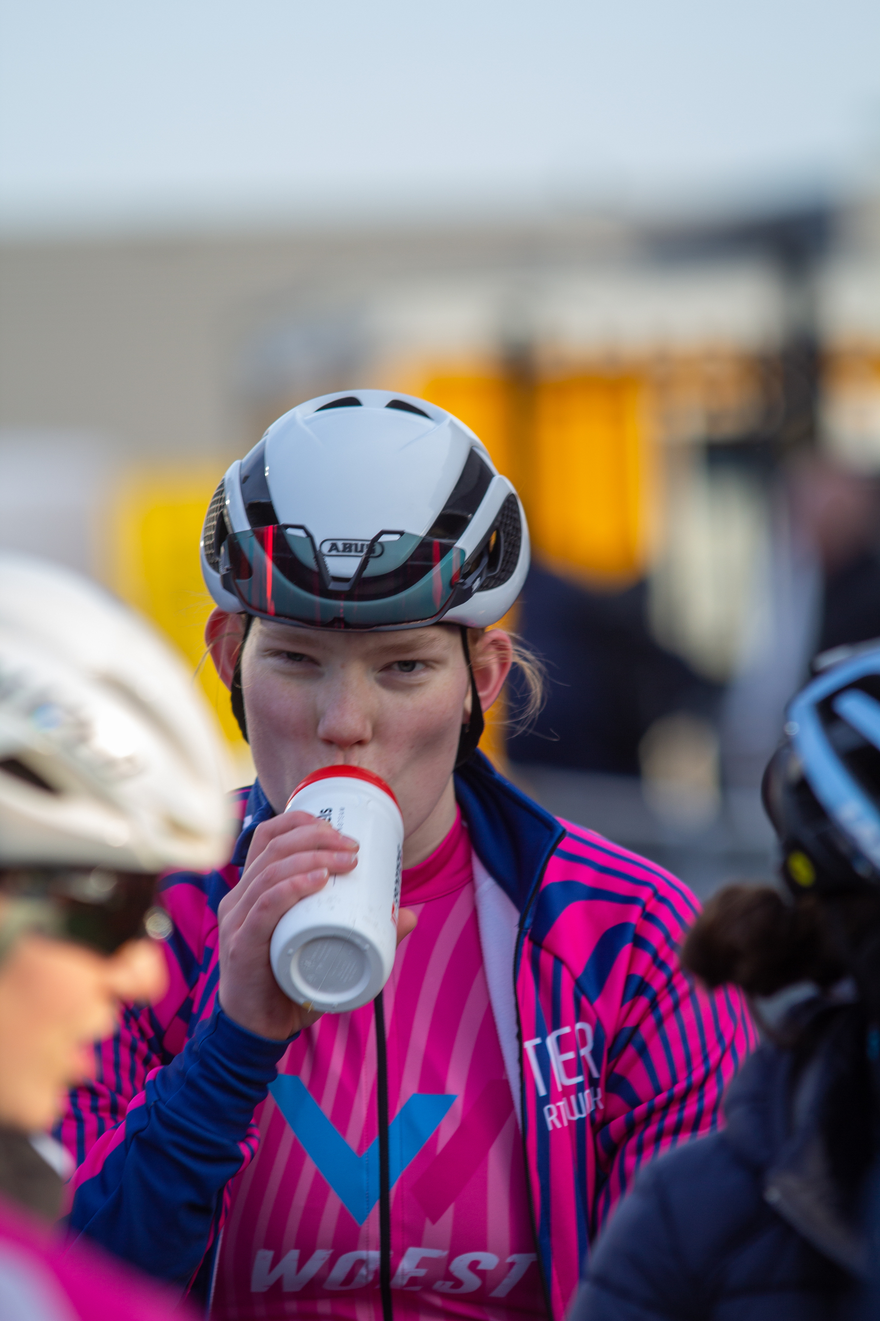 A cyclist takes a break to hydrate during the Noord West Overijssel Dames race.