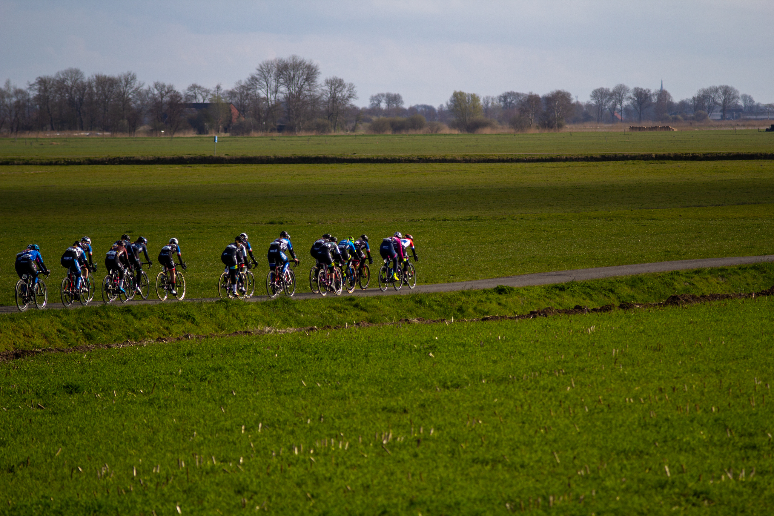 A group of cyclists participating in a cycling event in the Netherlands.