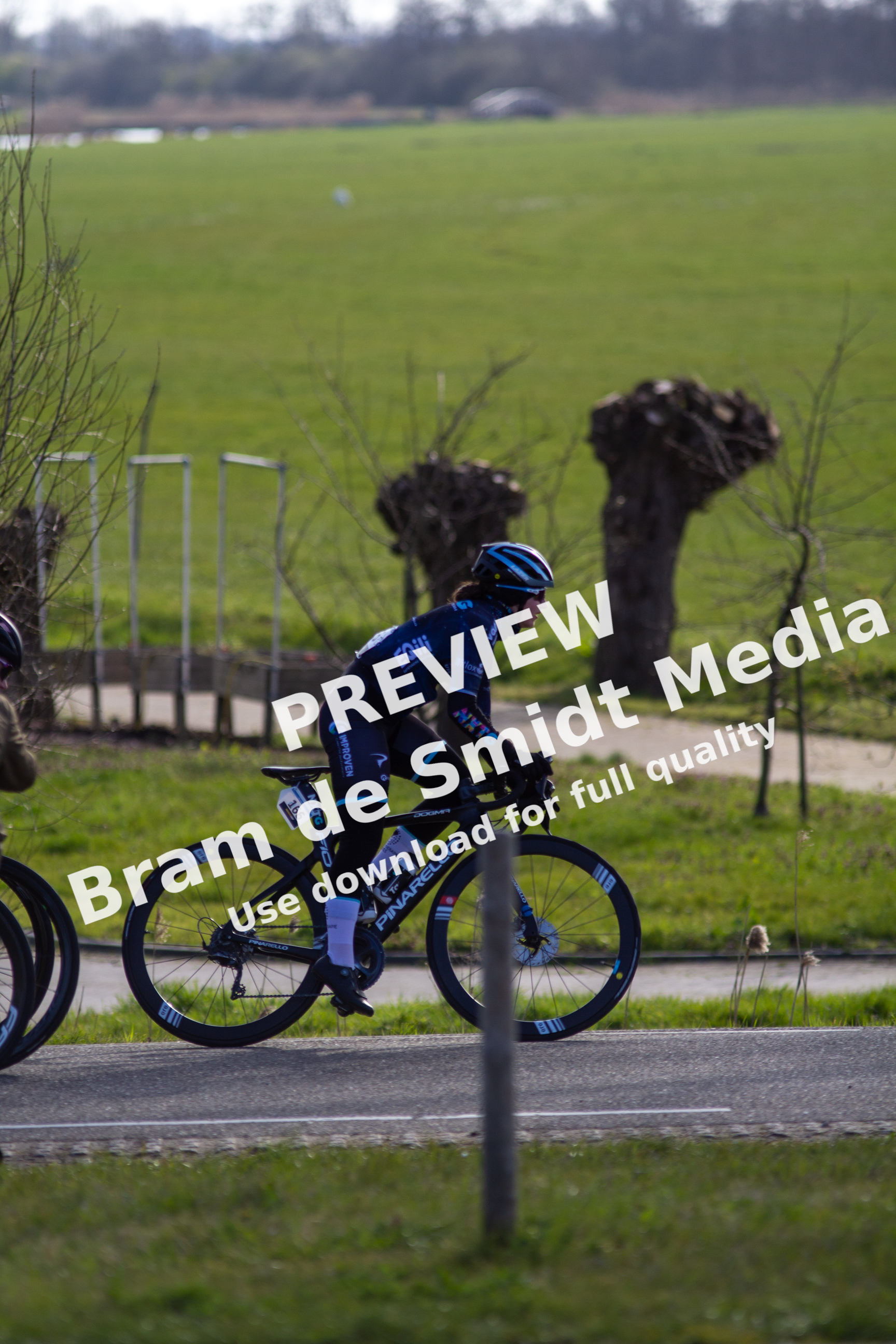 A man is racing on a bike in the Noord West Overijssel Dames.