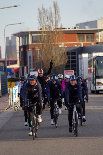 Several people on bicycles participating in a race.