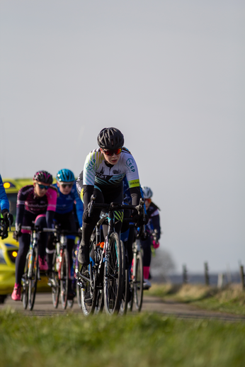 The group of cyclists in the photo are participating in a race at Noord West Overijssel, Netherlands.