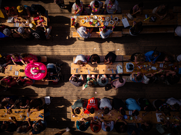 A table full of people with a red number 1 shirt in the middle.