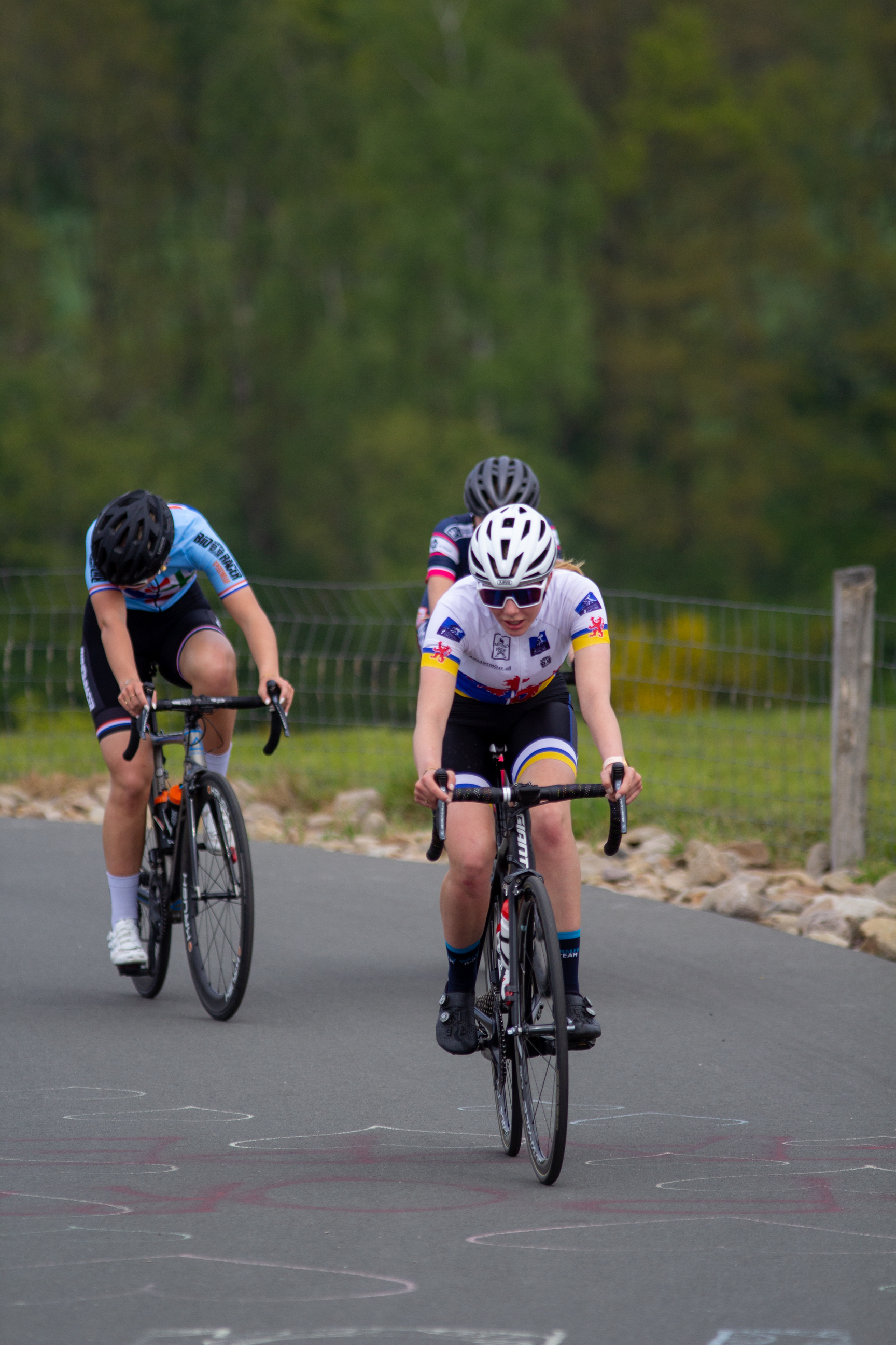 A woman on a bicycle riding in the Tour de France.