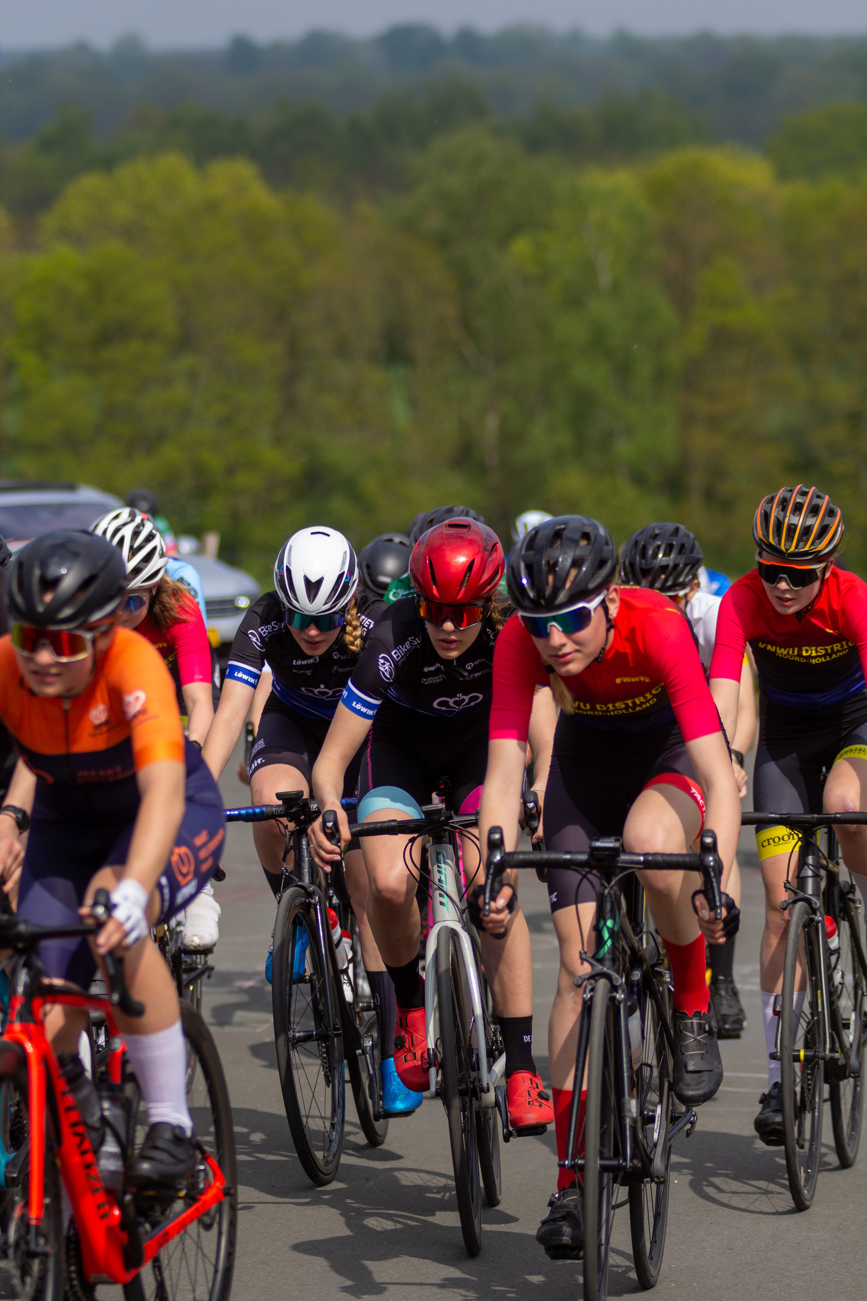 A group of cyclists race down the road at the Tweedaagse.