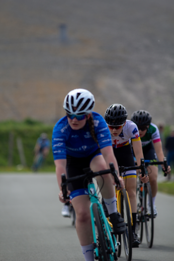 Dames Criterium participants race on a paved road during Tweedaagse.