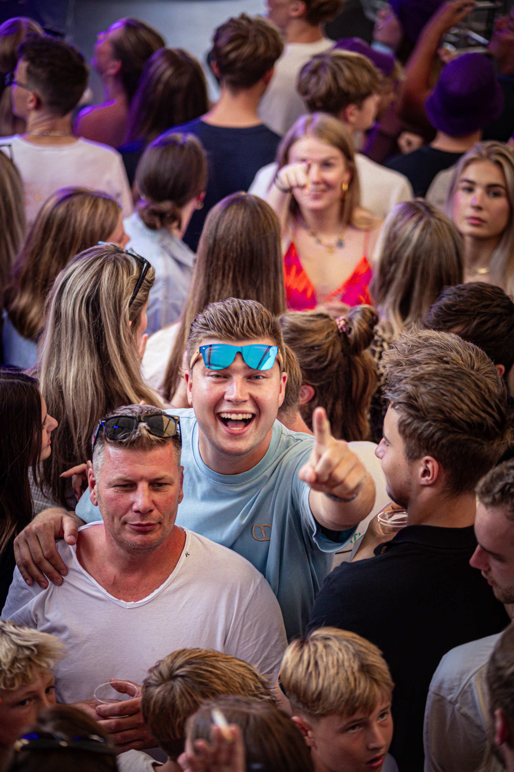 A group of young men are having a good time at an event.