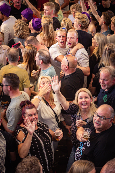 A group of people enjoying themselves at an event.