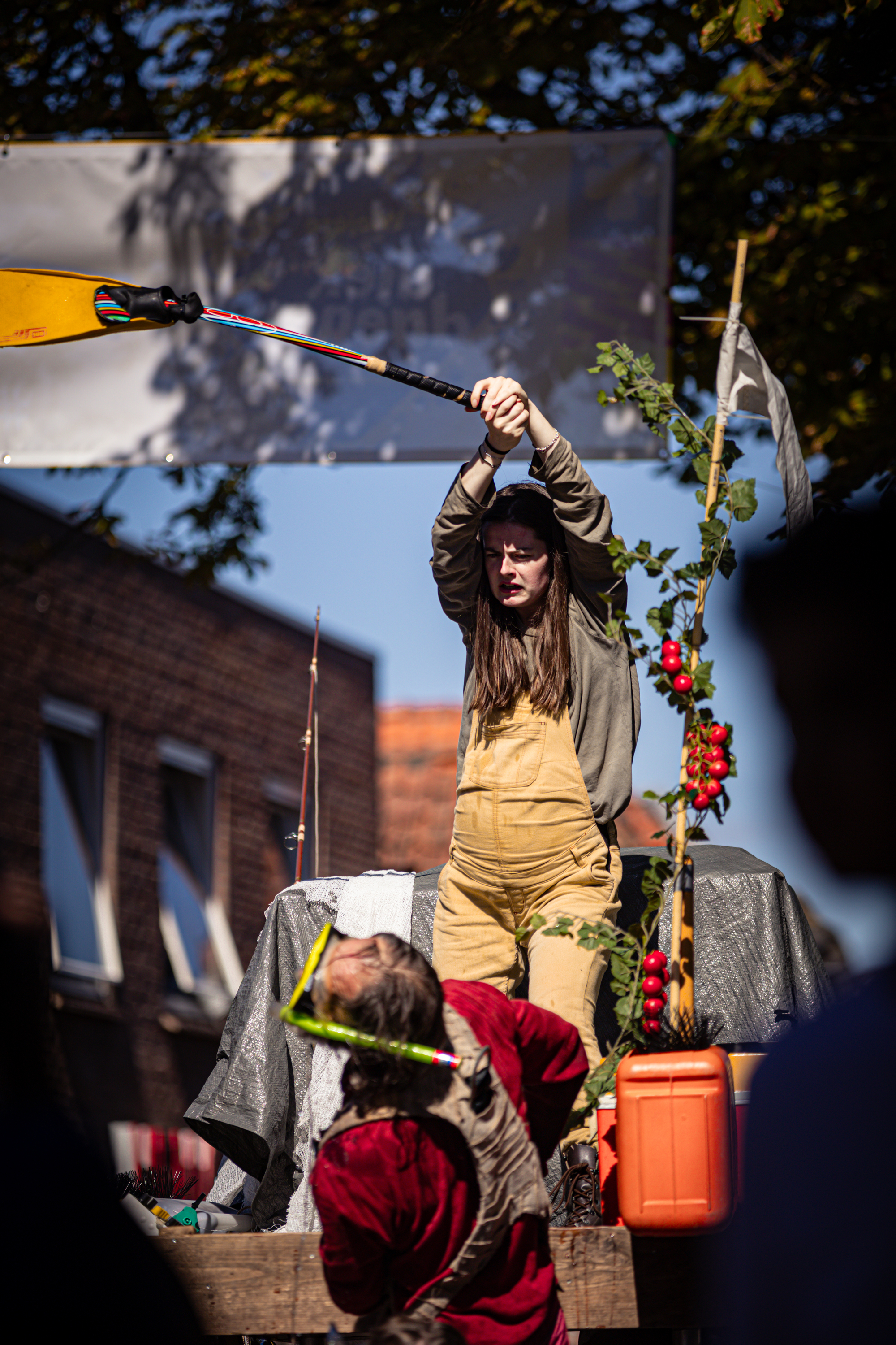 Two women are sitting in the wooden cart at V.I.F. Festival.