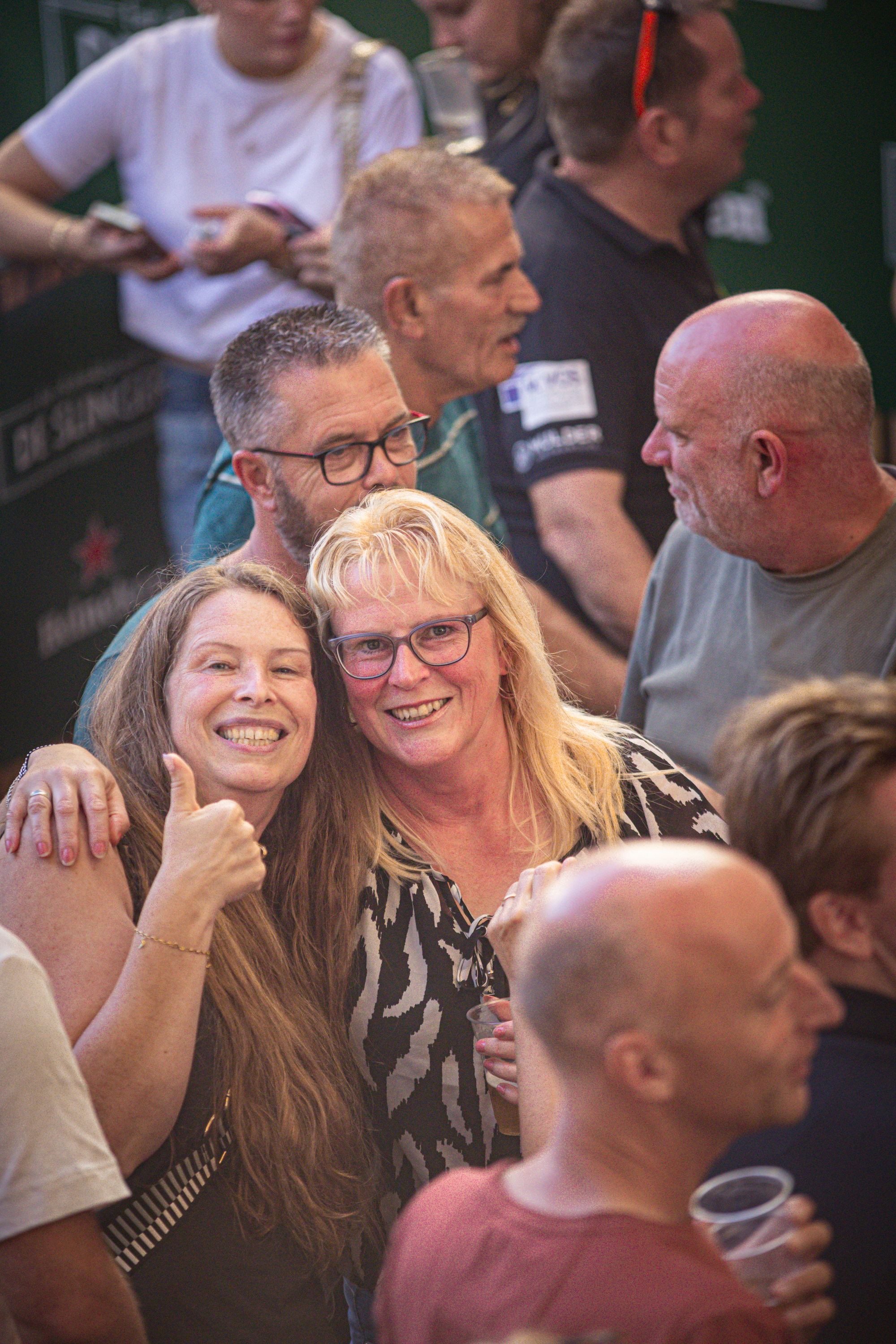 A group of people gathered for a photo at a festival.