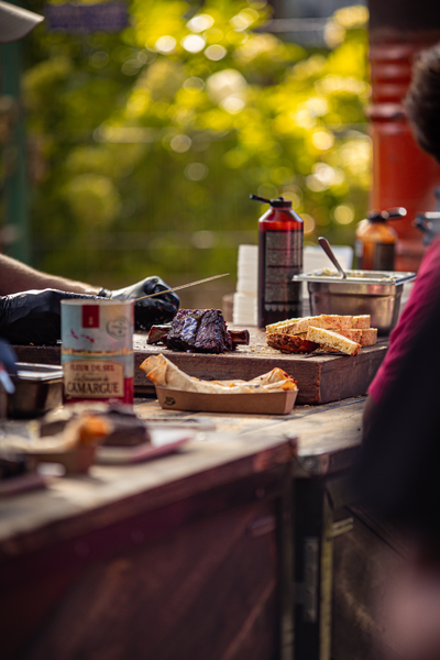 A table with various food items on it, including a brown pie.